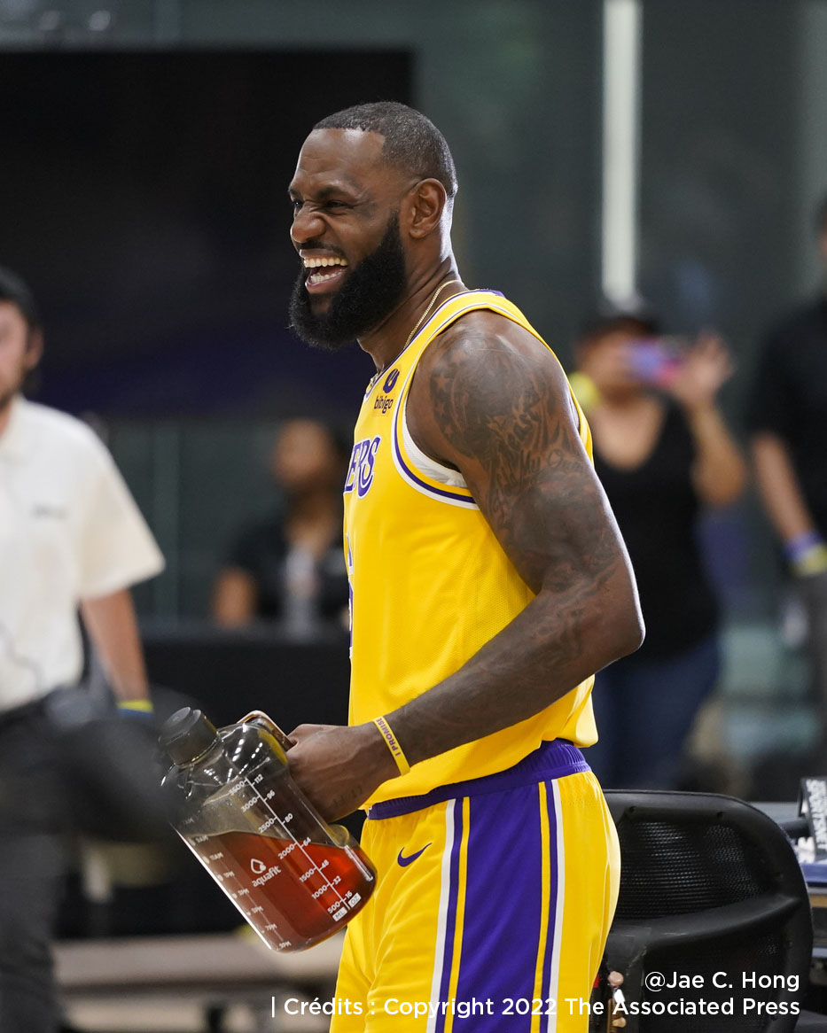 Los Angeles Lakers' LeBron James shares a laugh with staff members during the NBA basketball team's Media Day Monday, Sept. 26, 2022, in El Segundo, Calif. (AP Photo/Jae C. Hong)